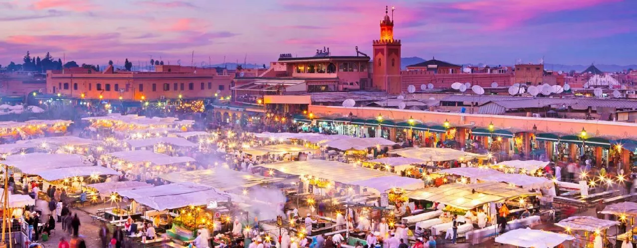 Jemaa el-Fna square and the Koutoubia minaret at dusk, Marrakech