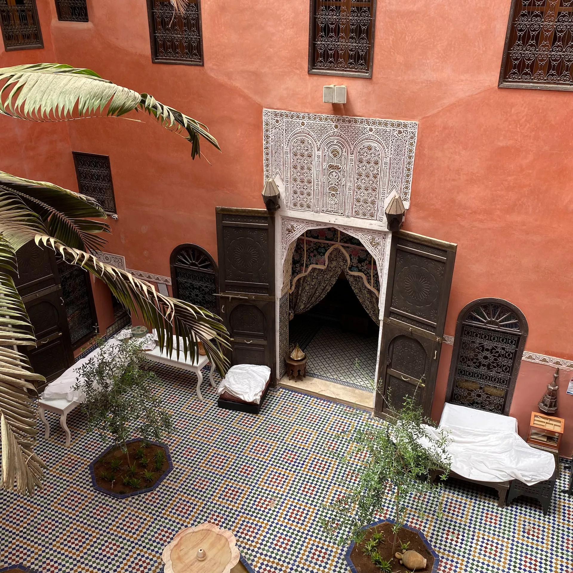 Riad courtyard with orange trees and carved stucco, Marrakech