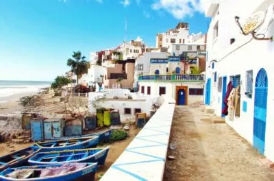 Fishing boats and whitewashed houses at Taghazout near Agadir