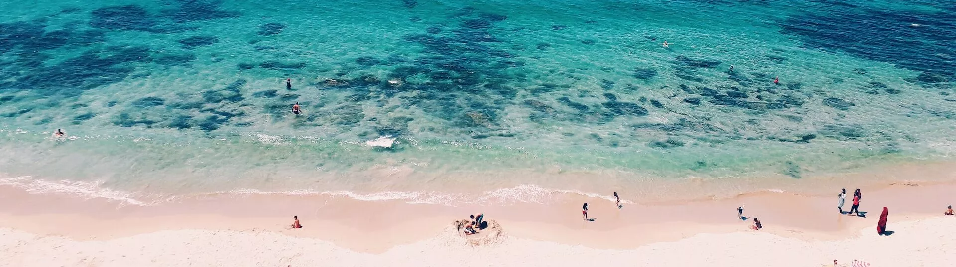 Aerial view of a sandy Atlantic beach with turquoise water, Morocco